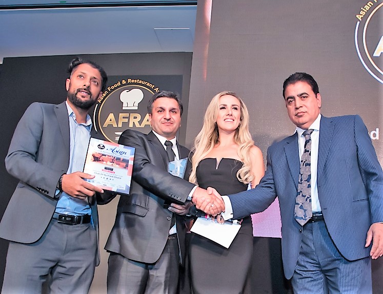 Mr. Frank Khalid from Chak 89 Recieving Restaurant Of The Year Award South West London from Head Of Montcalm Hotels